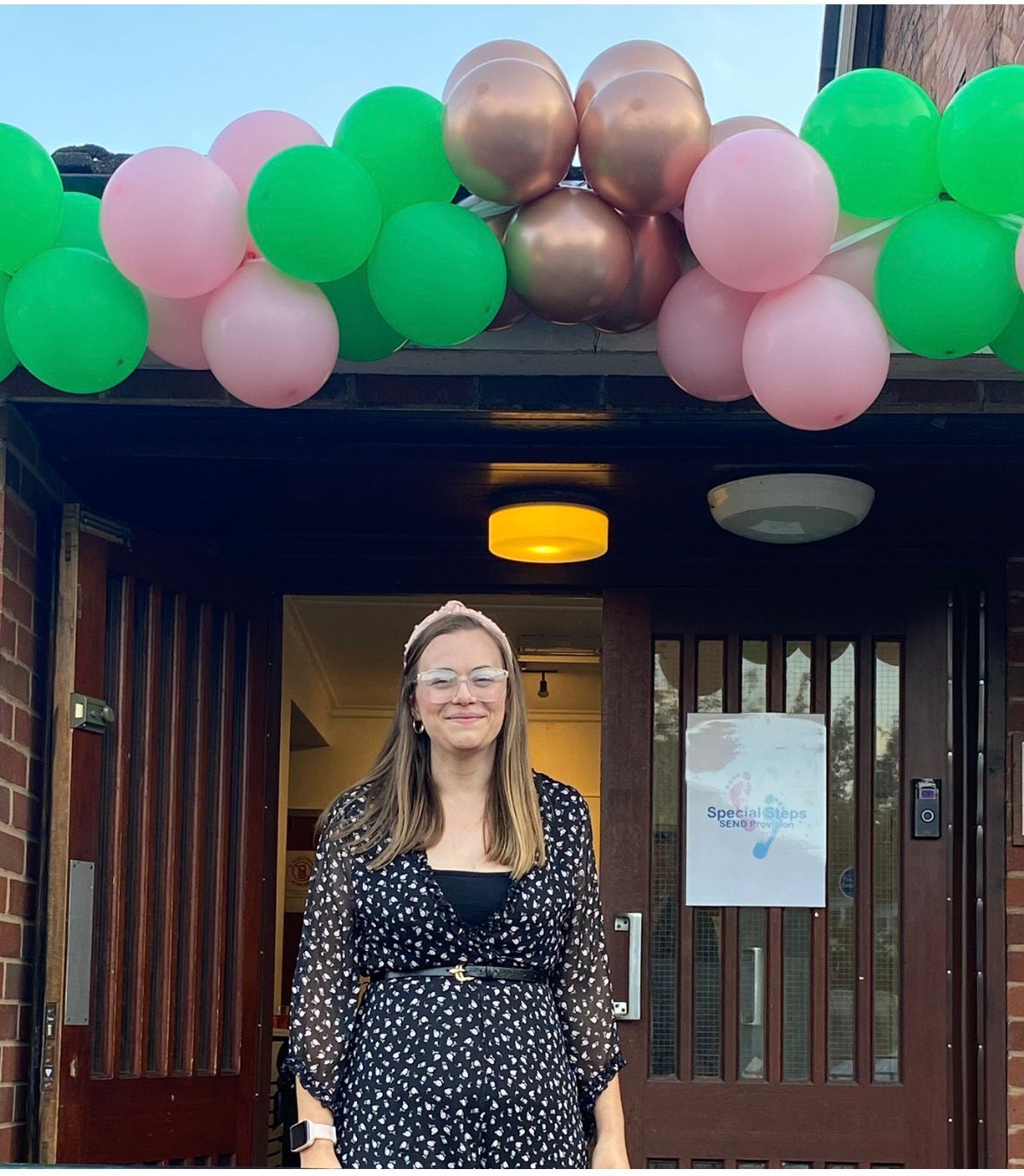 Becky outside the first Special Steps nursery building on opening day