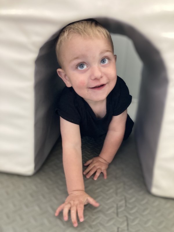 Child indoors smiling